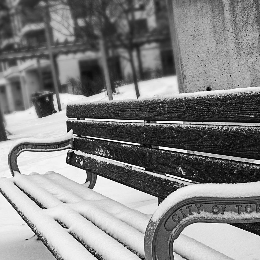 monochrome-photography-of-bench-covered-with-snow-894425.jpg